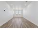 Bright living room with wood flooring and recessed lighting at 6840 Merseyside Ln, Castle Pines, CO 80108