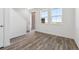 Inviting living room features natural light and wood flooring at 6840 Merseyside Ln, Castle Pines, CO 80108