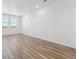 Spacious living room with wood flooring and natural light at 6840 Merseyside Ln, Castle Pines, CO 80108