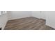 Bright living room with wood flooring and neutral paint at 6840 Merseyside Ln, Castle Pines, CO 80108