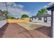 This backyard features a new fence, gravel bed, and a yard with new lawn squares at 2701 Barnhart St, Thornton, CO 80229