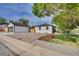 Charming home with a detached garage, spacious parking, and a landscaped yard at 2701 Barnhart St, Thornton, CO 80229