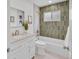 Stylish bathroom features a vanity with stone countertop and tiled backsplash, complete with neutral tile at 2701 Barnhart St, Thornton, CO 80229