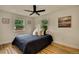 Sunlit bedroom offers neutral decor and hardwood floors, creating a relaxing and inviting retreat at 2701 Barnhart St, Thornton, CO 80229