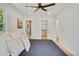 Cozy bedroom with a ceiling fan, closet, and an ensuite bathroom for added convenience at 2701 Barnhart St, Thornton, CO 80229