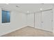 Bedroom with carpet flooring, a window, white walls, and closet with sliding doors at 2701 Barnhart St, Thornton, CO 80229