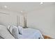 Bedroom featuring hardwood floors, closet, and ensuite bath, offering a serene space to relax at 2701 Barnhart St, Thornton, CO 80229