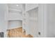 Spacious walk-in closet with custom shelving to maximize storage and organization at 2701 Barnhart St, Thornton, CO 80229