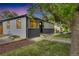 Charming single-story home with a well-maintained lawn, gray paint, and lovely landscaping at 2701 Barnhart St, Thornton, CO 80229