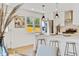 Bright kitchen with stainless steel appliances, quartz countertops, and eat-in island at 2701 Barnhart St, Thornton, CO 80229