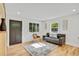 Inviting living room with hardwood floors, lots of natural light, and a welcoming ambiance at 2701 Barnhart St, Thornton, CO 80229