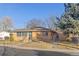 Ranch style home with brick exterior and accessible ramp at 1338 Aspen Pl, Longmont, CO 80501