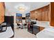 Mid-century modern kitchen with wood cabinets and black appliances at 1338 Aspen Pl, Longmont, CO 80501