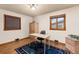 Home office with wood floors and built-in shelving at 1338 Aspen Pl, Longmont, CO 80501