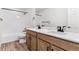 Bathroom featuring dual vanity sinks and a shower with black fixtures at 25041 E 38Th Ave, Aurora, CO 80019