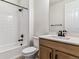 Well-lit bathroom features modern fixtures, a bathtub with shower, and a vanity with solid surface counters at 25041 E 38Th Ave, Aurora, CO 80019