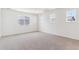 Spacious bedroom with three windows, carpeted floors and ample natural light at 25041 E 38Th Ave, Aurora, CO 80019