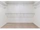 Walk-in closet featuring multiple levels of metal shelving at 25041 E 38Th Ave, Aurora, CO 80019