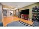 Spacious basement features hardwood floors, media center and cozy seating area at 12051 E Lake Cir, Greenwood Village, CO 80111