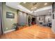 Spacious basement featuring a stone water feature, hardwood floors and cozy seating area at 12051 E Lake Cir, Greenwood Village, CO 80111