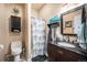 Charming bathroom with dark wood vanity, and custom shower at 12051 E Lake Cir, Greenwood Village, CO 80111