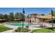 Stunning community pool with seating and shade covers; ideal for relaxation and socializing at 12051 E Lake Cir, Greenwood Village, CO 80111