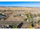 Expansive aerial view of a beautiful property with multiple buildings surrounded by lush greenery at 12901 2Nd St, Parker, CO 80134