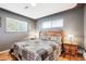 Relaxing bedroom featuring hardwood floors, neutral walls, and lots of natural light at 12901 2Nd St, Parker, CO 80134
