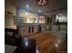 Open-concept dining and living area with access to the bar and kitchen at 12901 2Nd St, Parker, CO 80134