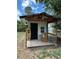 Charming outdoor cabana featuring a coastal design, wooden deck, and bar seating, perfect for relaxation at 12901 2Nd St, Parker, CO 80134