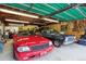 Well-lit garage featuring two vintage vehicles, showcasing ample space for car enthusiasts at 12901 2Nd St, Parker, CO 80134