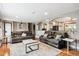 Spacious living room with hardwood floors and a seamless connection to the kitchen at 12901 2Nd St, Parker, CO 80134