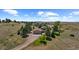 Aerial view of house, expansive yard, and surrounding landscape at 9696 E Sand Lily Ln, Parker, CO 80134