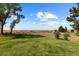 Landscaped backyard with expansive views and large lawn area at 9696 E Sand Lily Ln, Parker, CO 80134