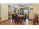 Bright dining area with hardwood floors and scenic views at 9696 E Sand Lily Ln, Parker, CO 80134