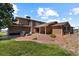 Brick patio with outdoor grill and seating area at 9696 E Sand Lily Ln, Parker, CO 80134