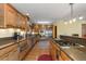 Modern kitchen with stainless steel appliances and granite counters at 9696 E Sand Lily Ln, Parker, CO 80134