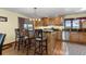 Eat-in kitchen with wood cabinets and island at 9696 E Sand Lily Ln, Parker, CO 80134