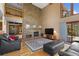 Open living room with high ceilings and a fireplace at 9696 E Sand Lily Ln, Parker, CO 80134