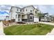 Charming home featuring a welcoming porch, well-maintained lawn, and a two-car garage at 24798 E 40Th Ave, Aurora, CO 80019