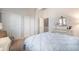 Bright bedroom featuring large closets, a comfortable bed, and a classic dresser at 5252 W 68Th Ave, Arvada, CO 80003