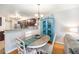 Open concept dining area adjacent to the kitchen and featuring a charming dining table at 5252 W 68Th Ave, Arvada, CO 80003