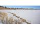 View of the frozen lake offering a tranquil winter backdrop at 5252 W 68Th Ave, Arvada, CO 80003
