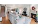 Inviting living room featuring a fireplace, open floorplan, and stylish decor at 5252 W 68Th Ave, Arvada, CO 80003