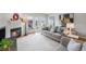 Bright living room with fireplace, plush seating, and sliding glass doors to the back patio at 5252 W 68Th Ave, Arvada, CO 80003