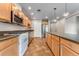 Charming kitchen features stainless steel appliances and lots of cabinet storage at 1631 N Emerson St # 207, Denver, CO 80218