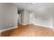 Bright and airy living room with hardwood floors, a ceiling fan, and a view of the ensuite bath at 1631 N Emerson St # 207, Denver, CO 80218