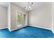 Living Room with French Doors and an elegant chandelier at 1631 N Emerson St # 207, Denver, CO 80218