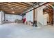 Unfinished basement with exposed ceiling and concrete floor, offering potential for customization at 7485 S Jackson Gap Way, Aurora, CO 80016