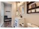 Updated bathroom with a modern vanity, black hardware, and stylish decor at 7485 S Jackson Gap Way, Aurora, CO 80016